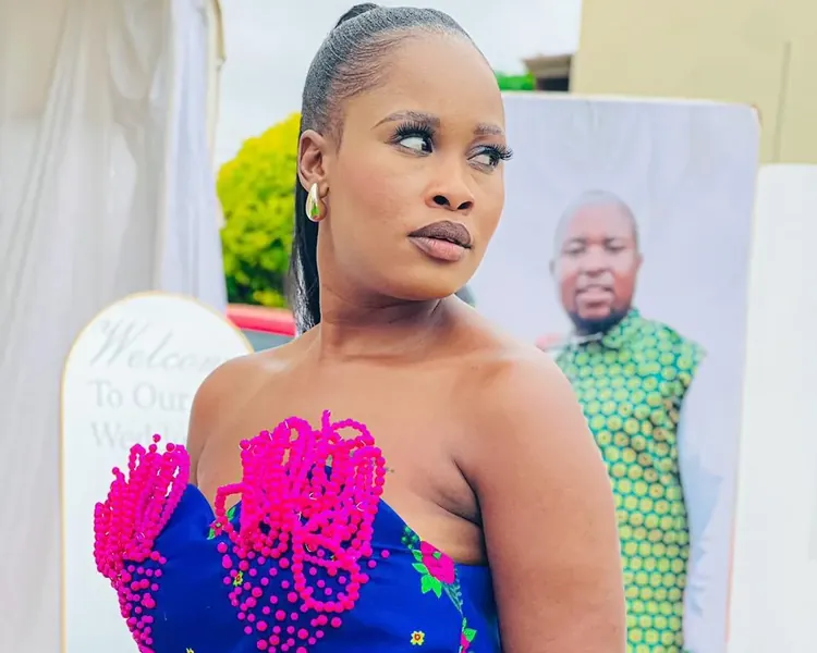 Nthabi at a wedding, looking away in thought